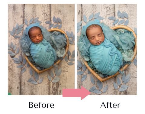 A baby wrapped in a blue blanket is sleeping in a heart shaped basket