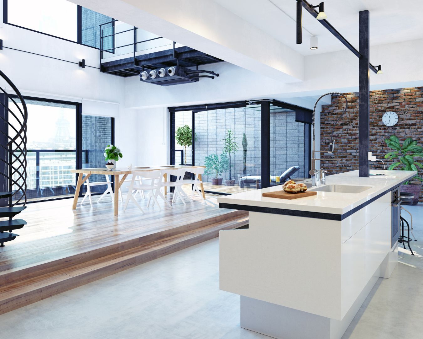 A kitchen with a large island and a spiral staircase