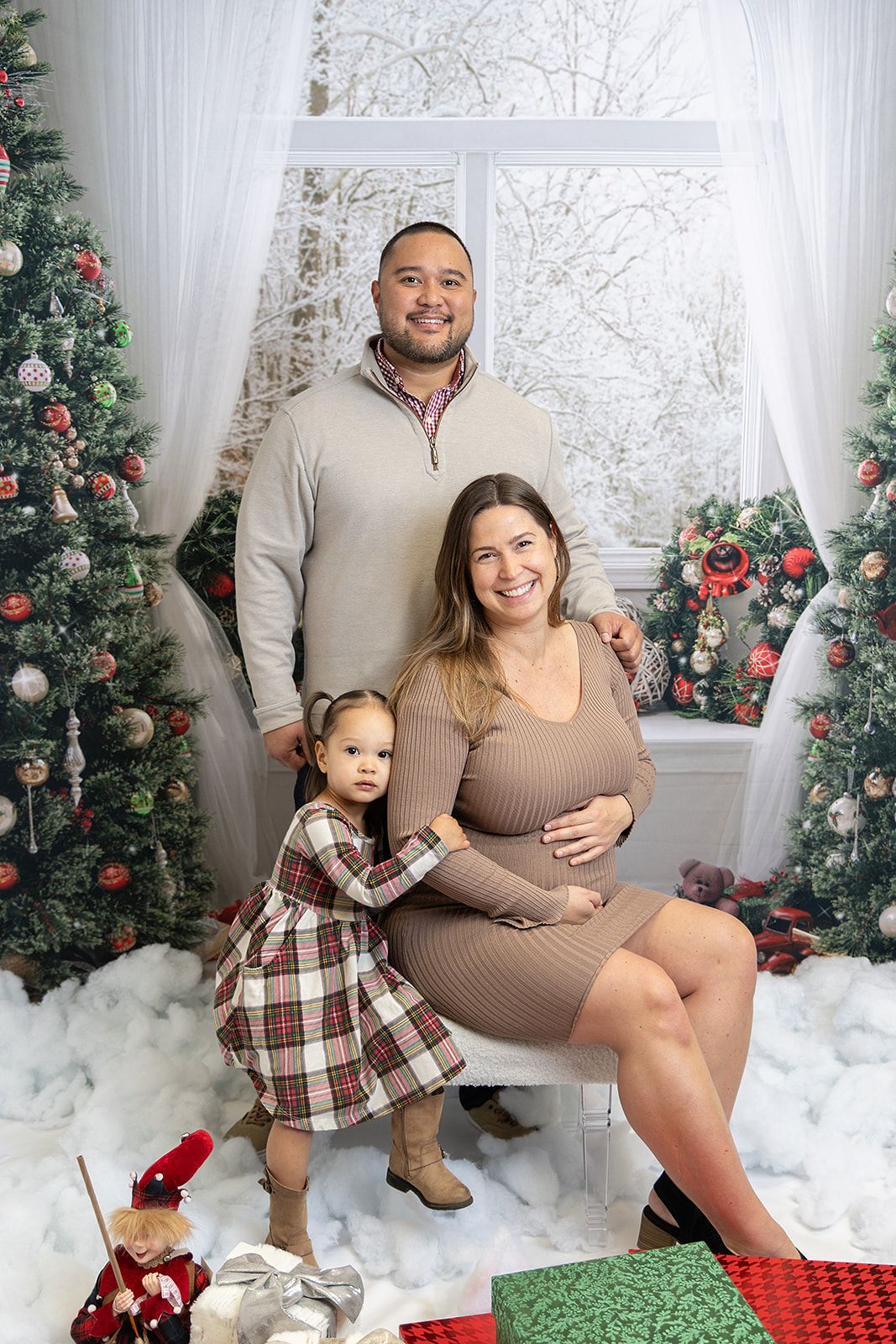 A family with a winter-themed Christmas picture