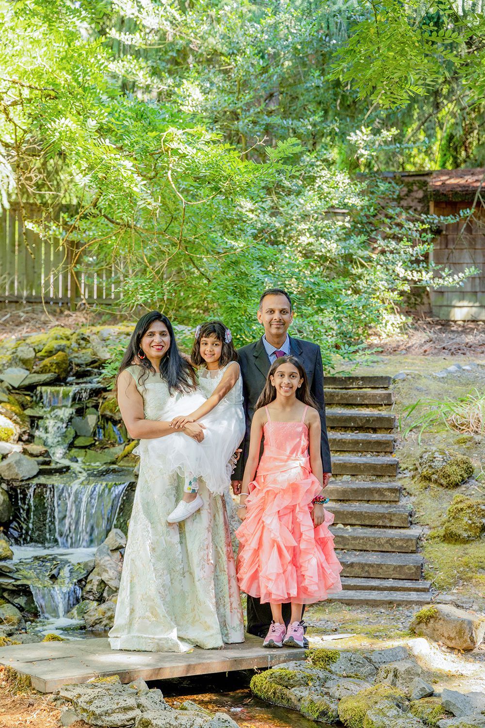 A family beside a waterfall