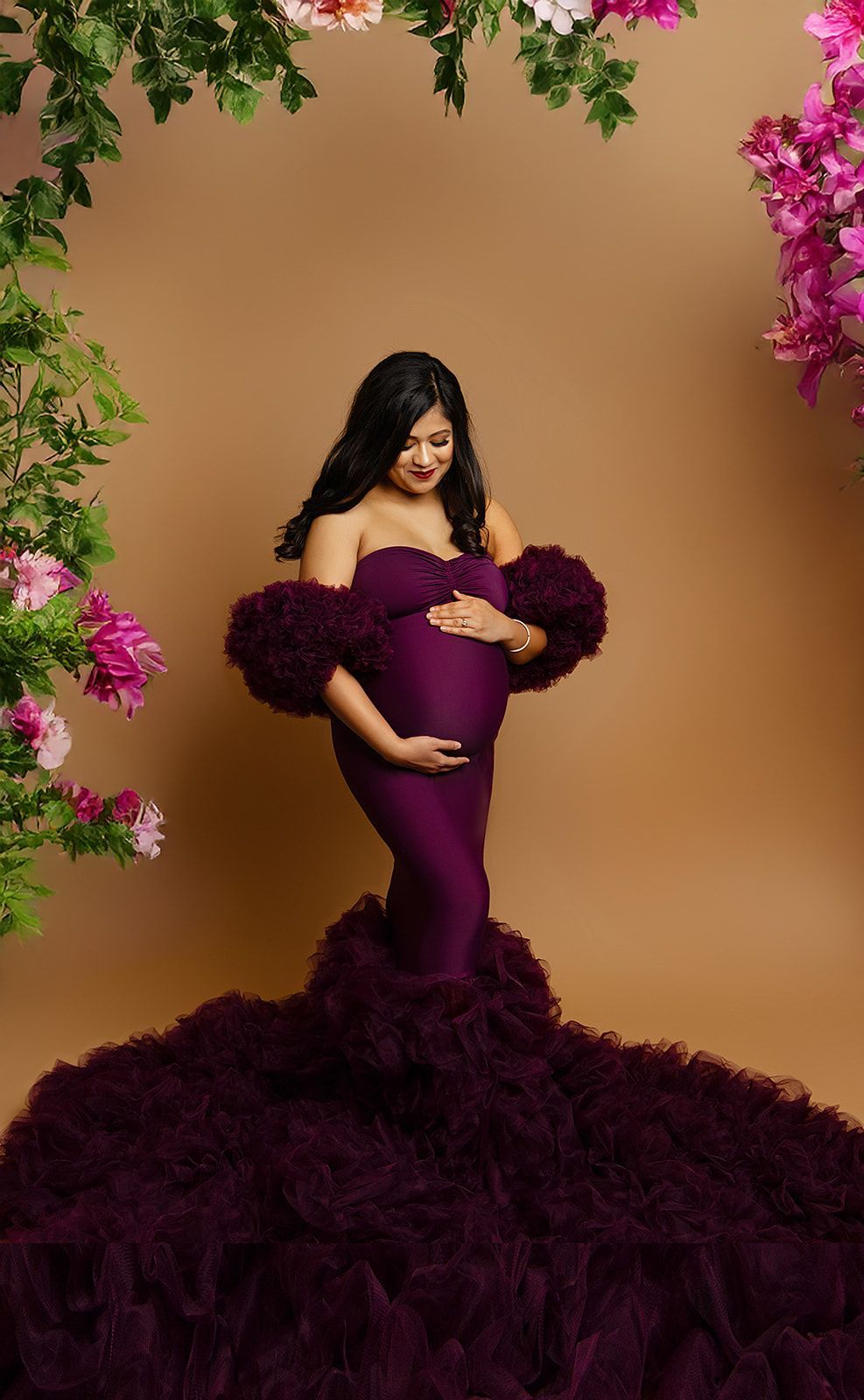 A pregnant woman in a purple dress