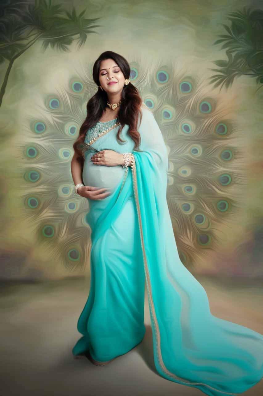A pregnant woman in a blue saree