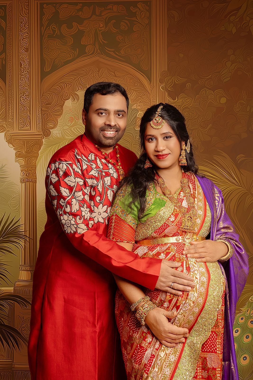 A man and a pregnant woman are posing for a picture.