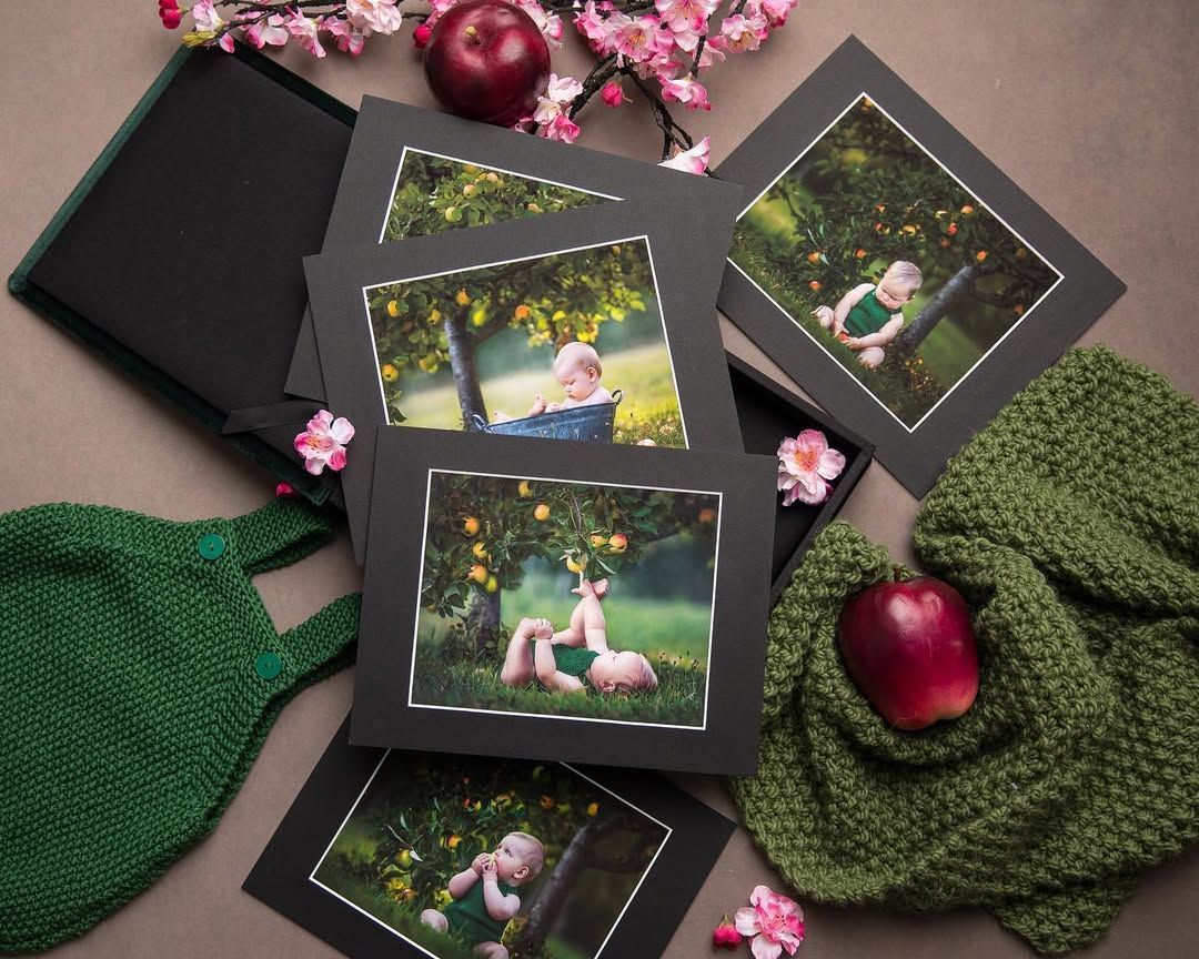 A stack of pictures of a baby sitting under an apple tree