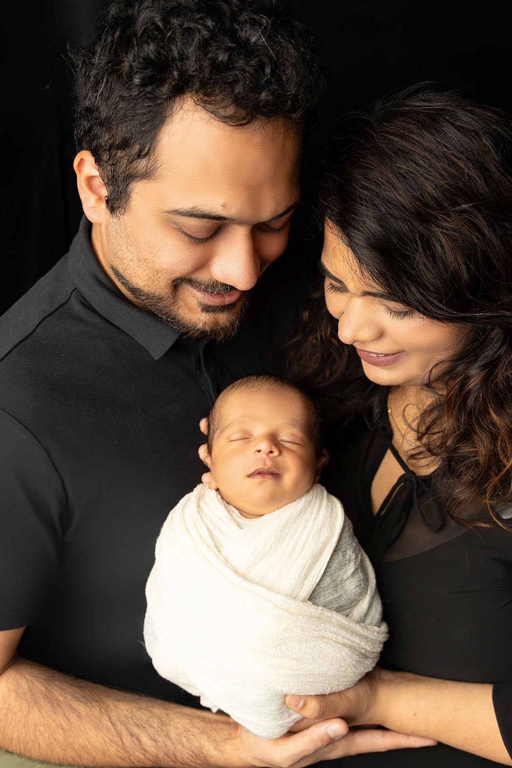 Newborn baby with mom and dad