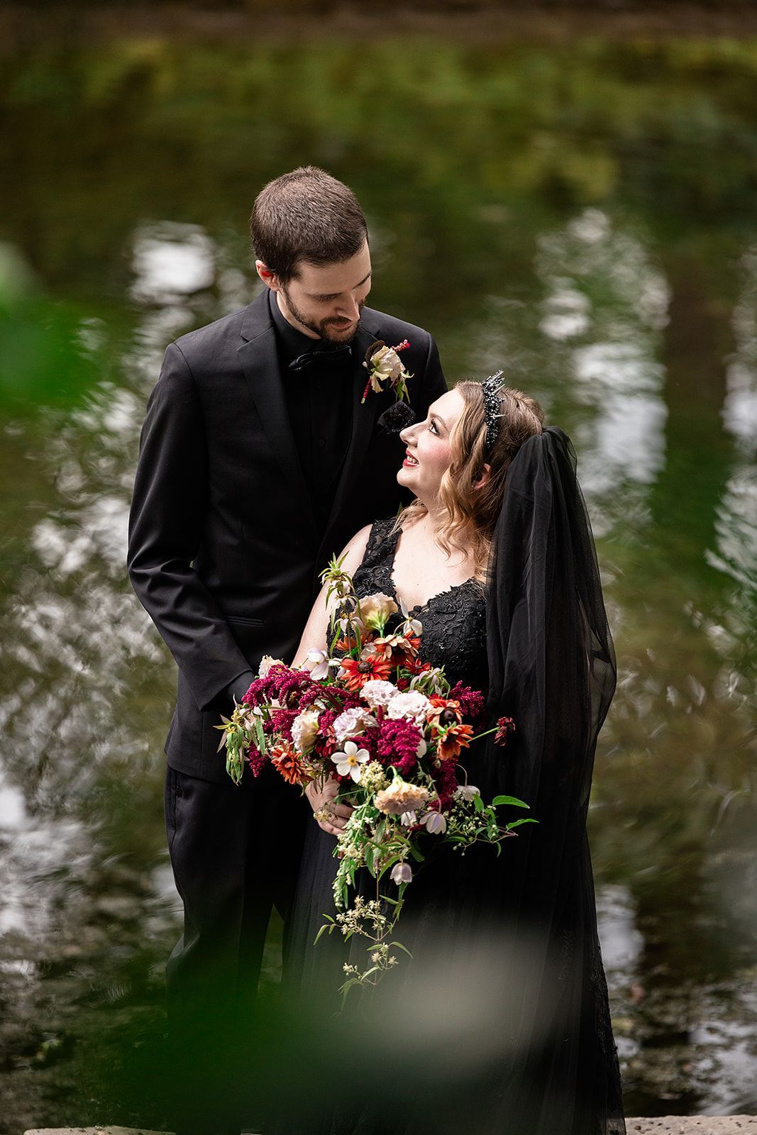 Bride and groom wearing all black outfits