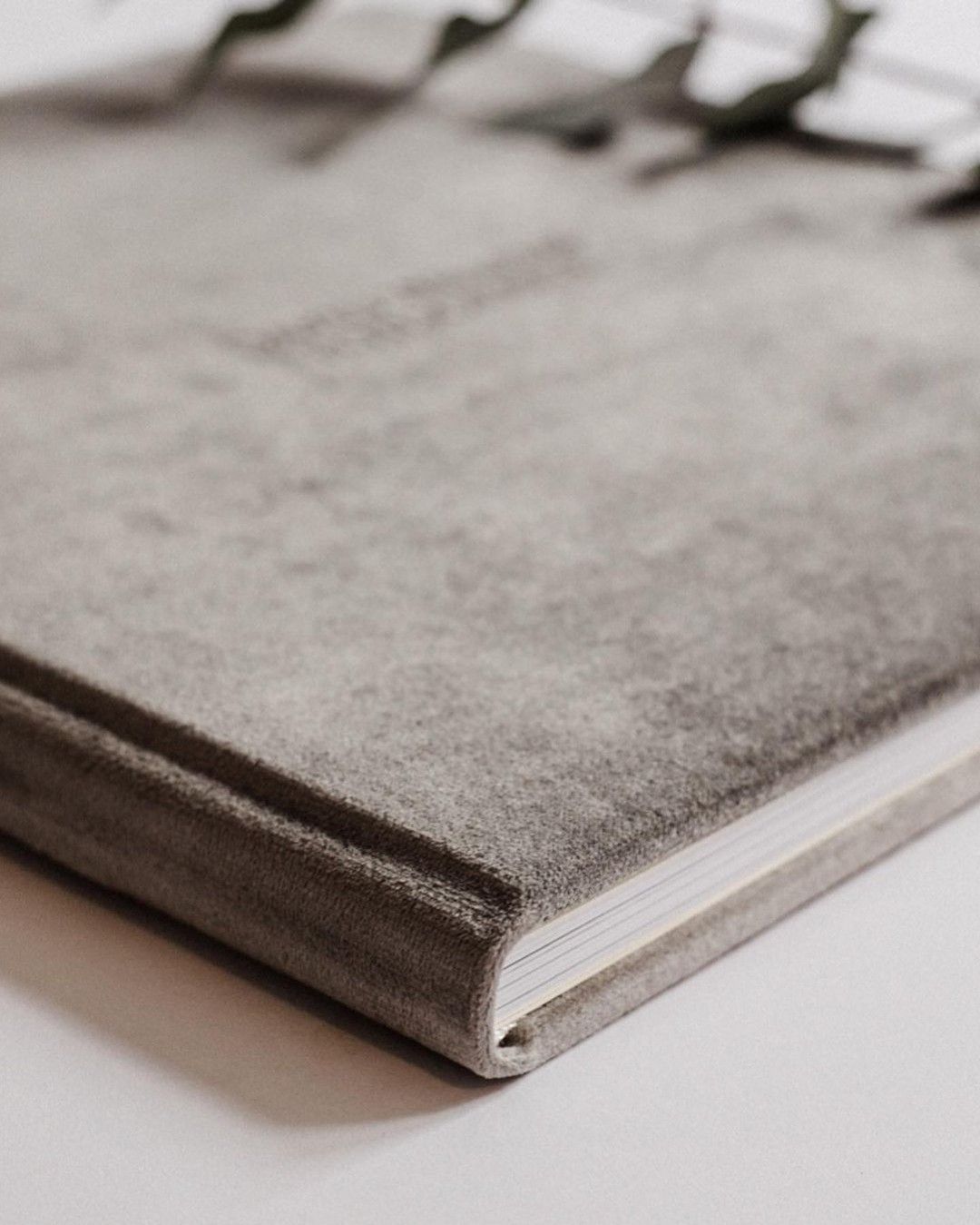 A close up of a book on a white surface