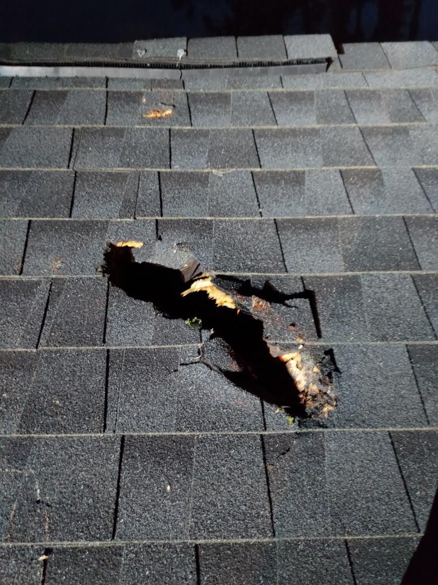 A close up of a roof with a hole in it