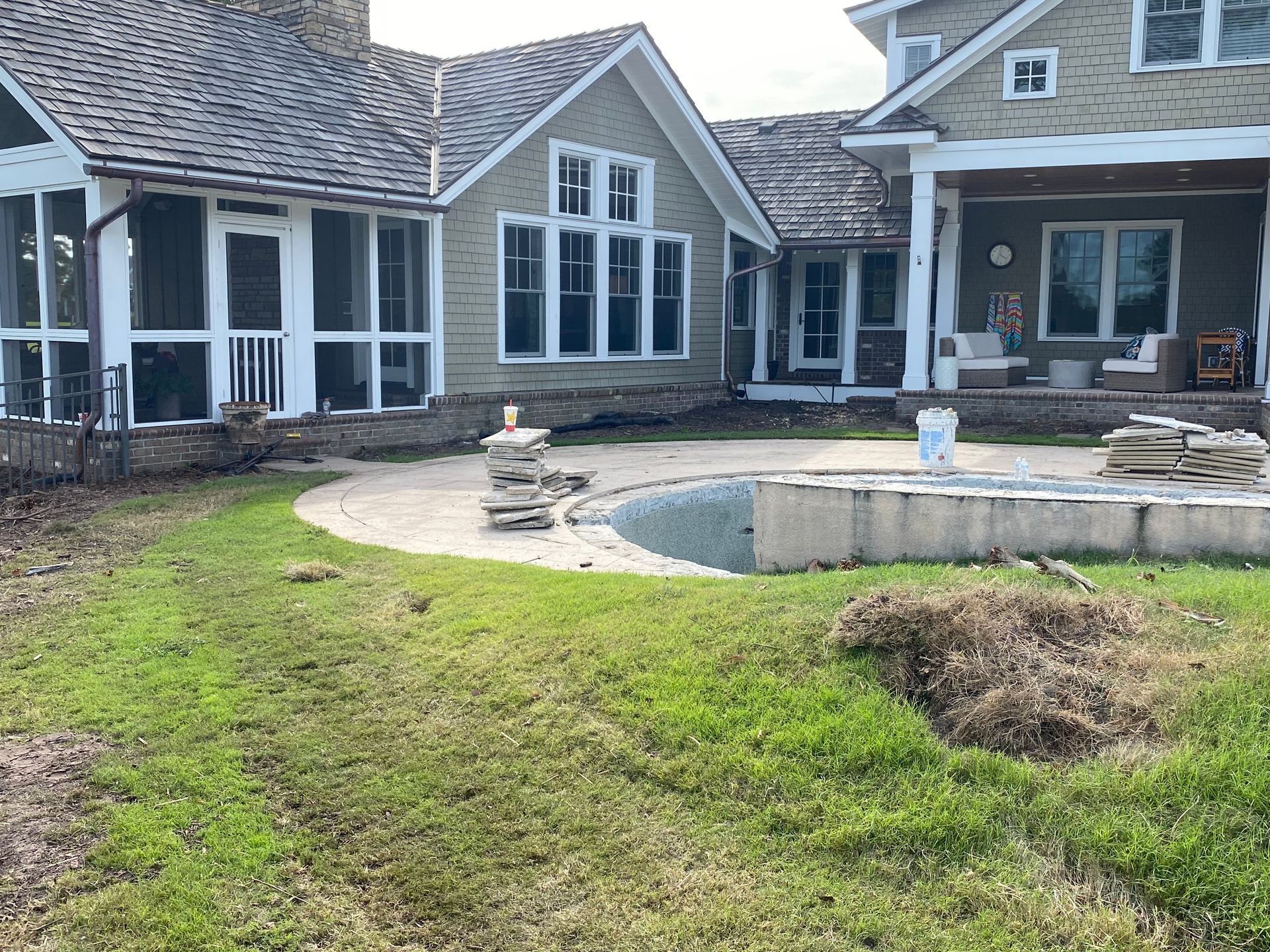 A large house with a swimming pool in the backyard.