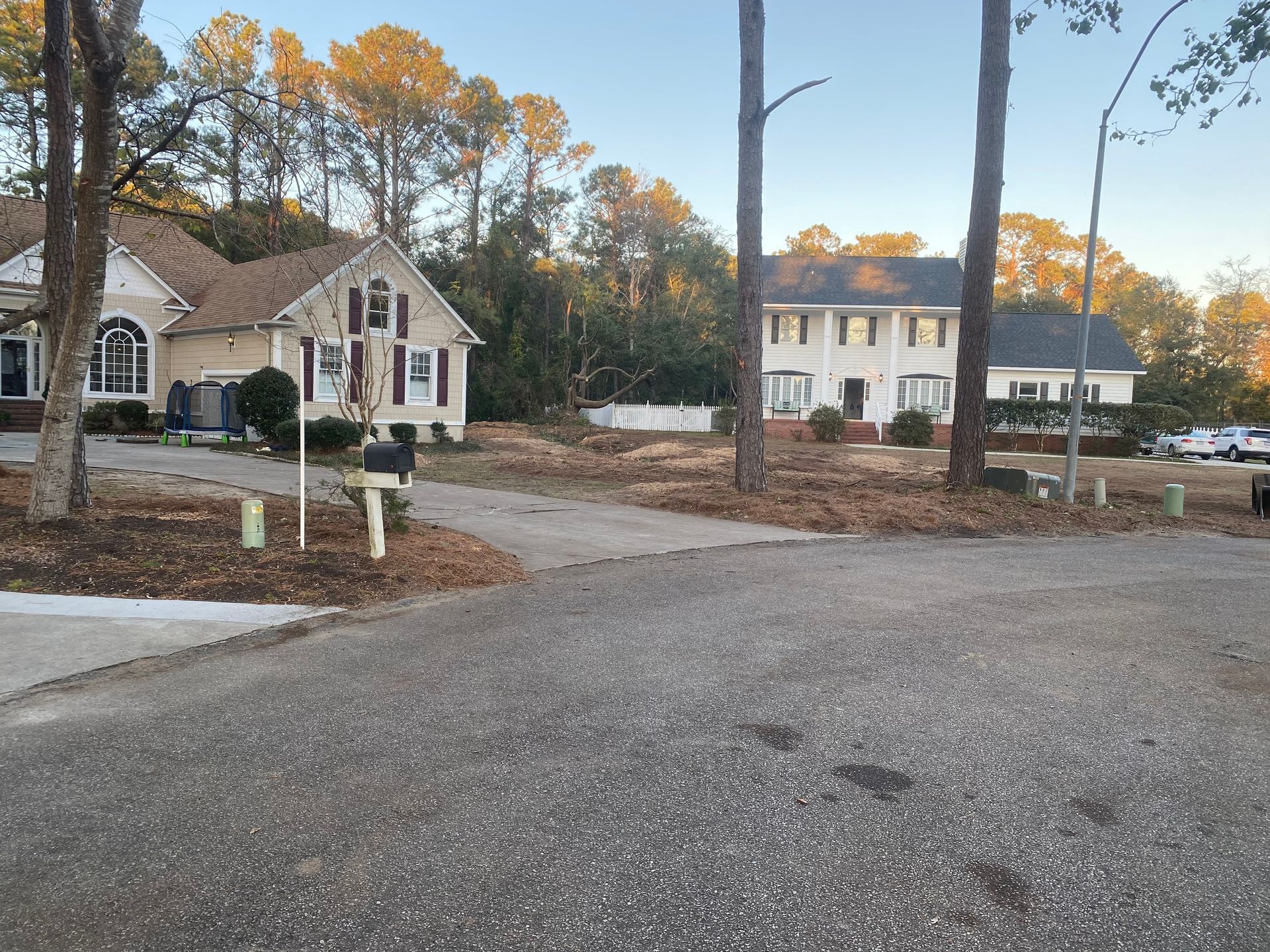 A couple of houses are sitting next to each other in a residential area.