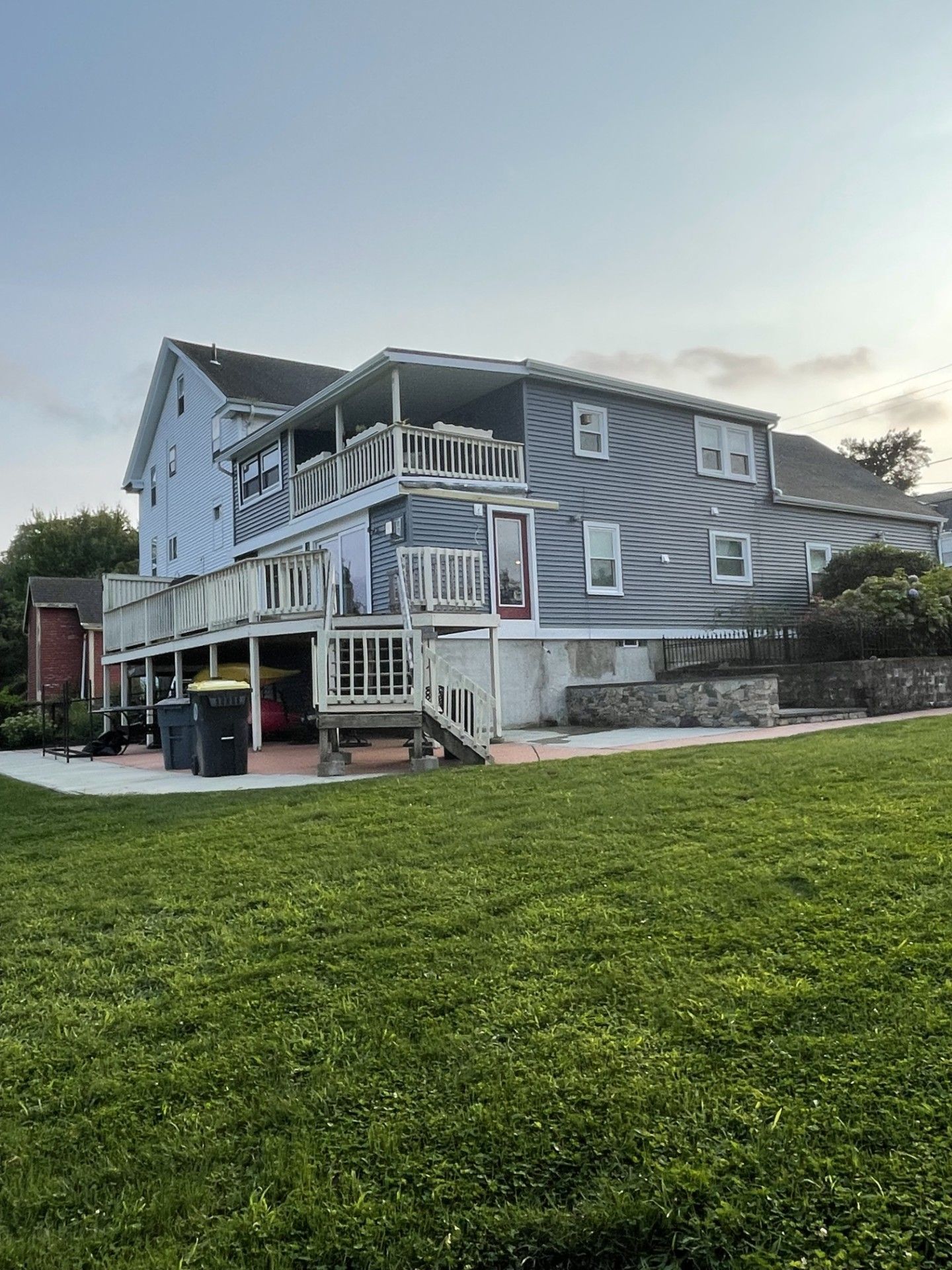 A large house with a large lawn in front of it