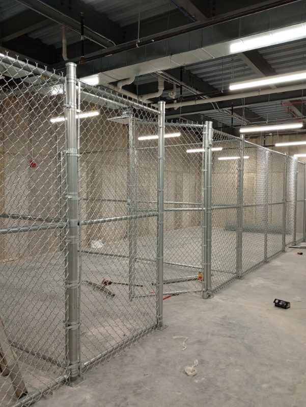A chain link fence installed in a building