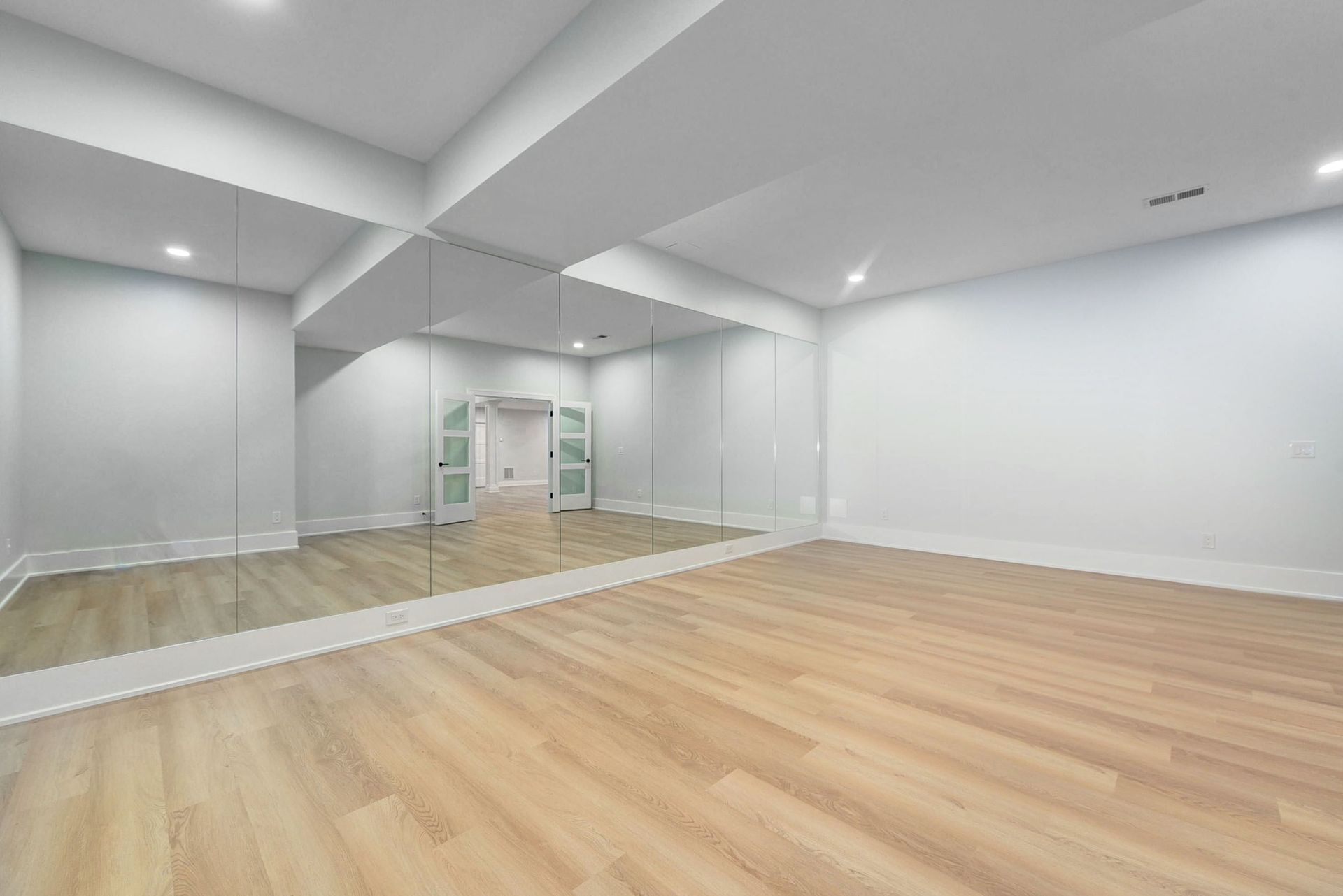 There is a large mirror in the middle of the room.