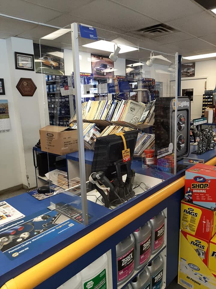 A counter in a store with boxes of thor oil on it