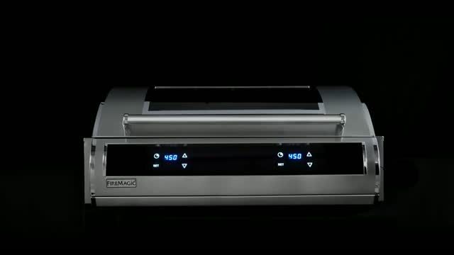 Stainless steel countertop appliance with digital controls on a black background