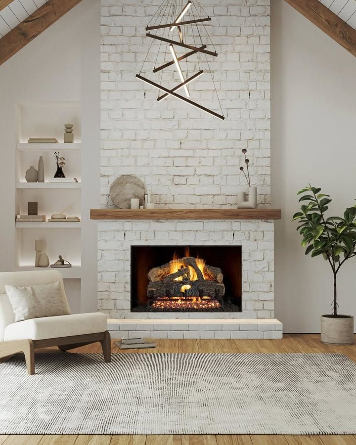 Cozy living room with white brick fireplace, modern chandelier, beige chair, built-in shelves, and a patterned rug