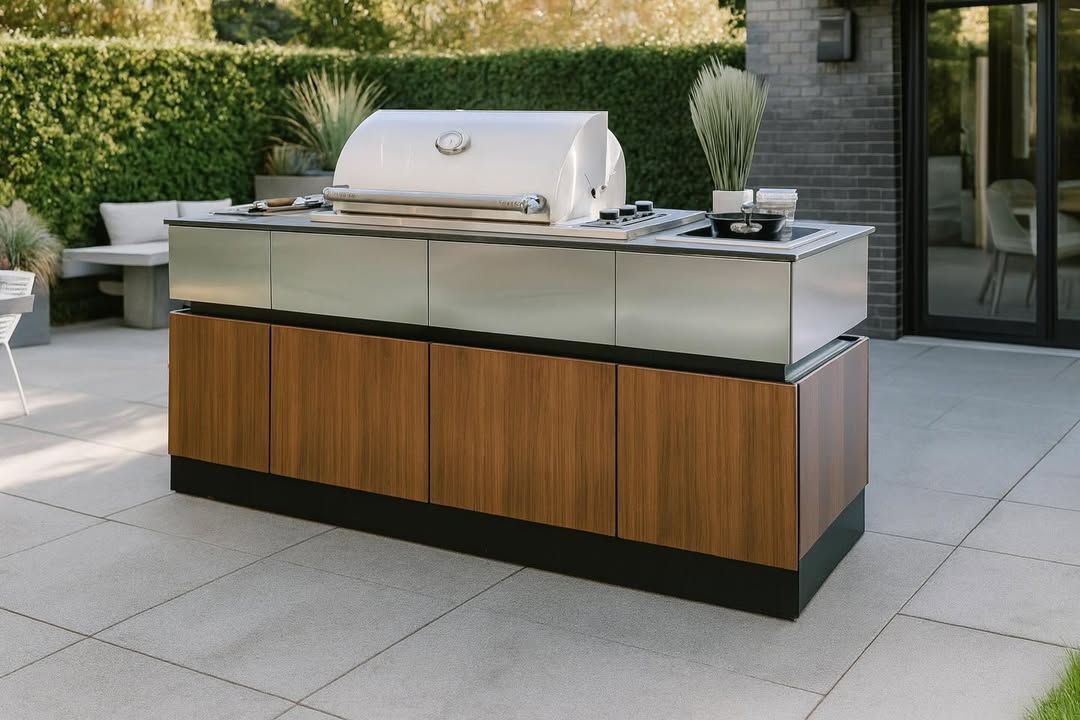 Modern stainless steel outdoor grill with wooden cabinet on a patio