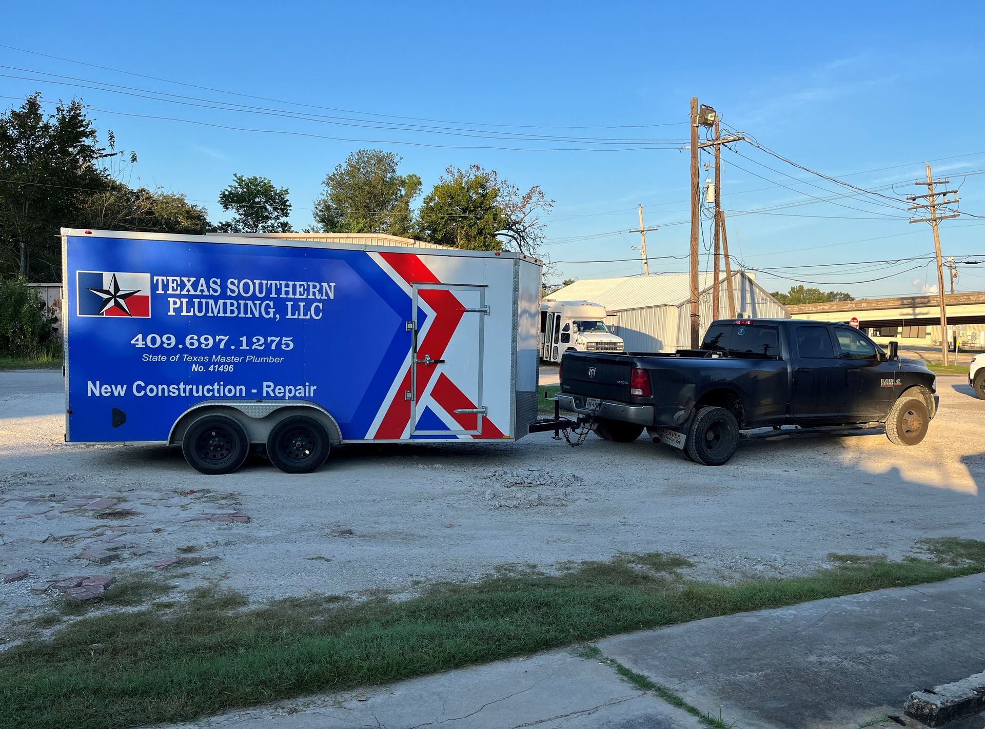 A truck is towing a trailer that says lucas southern plumbing llc
