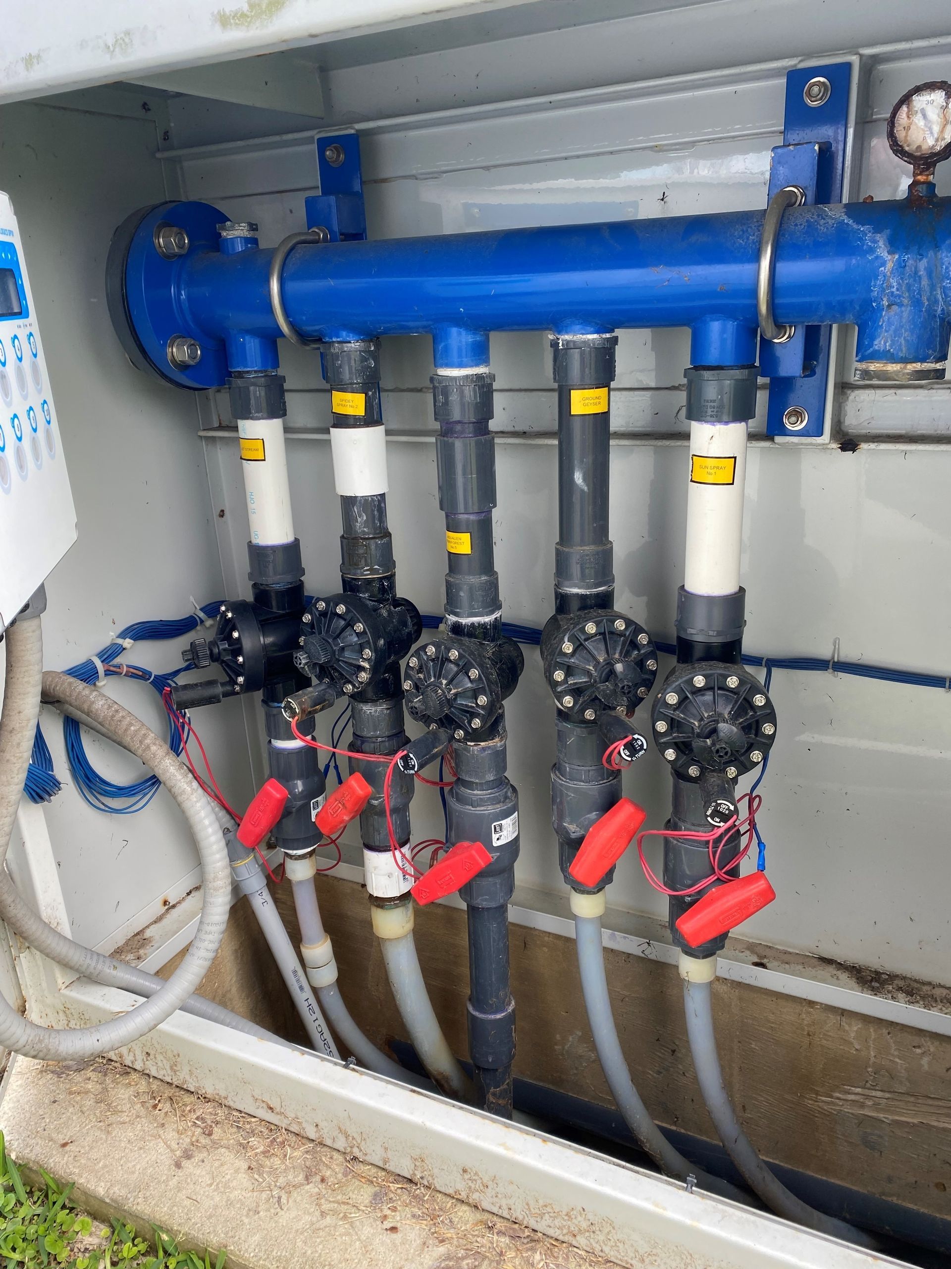 A bunch of pipes are connected to each other in a box