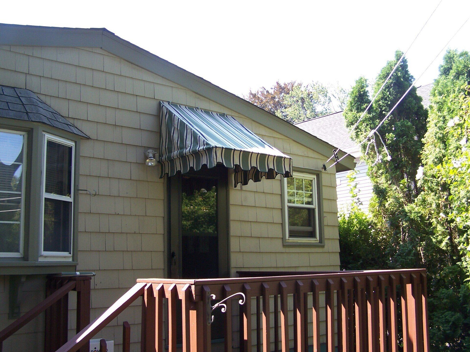 A house with a awning over the front door