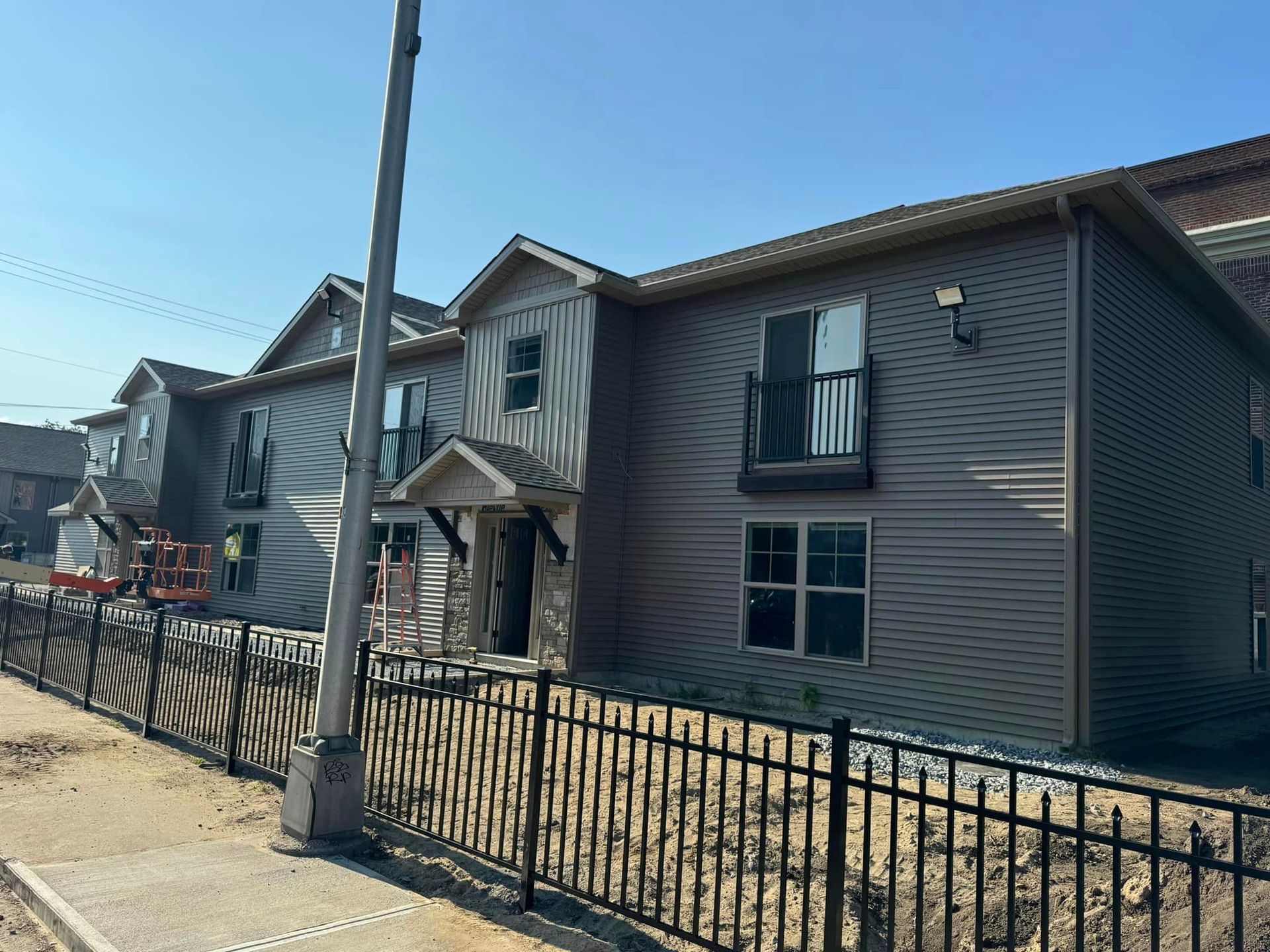 A building with a fence around it is under construction