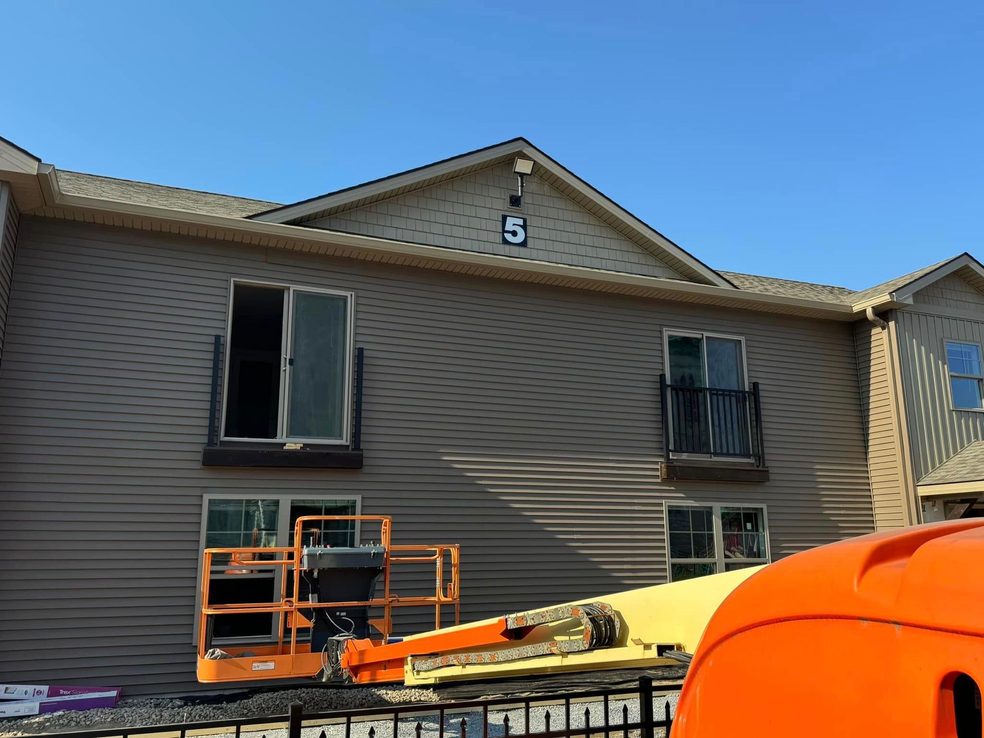 A building under construction with number 5 near the roof