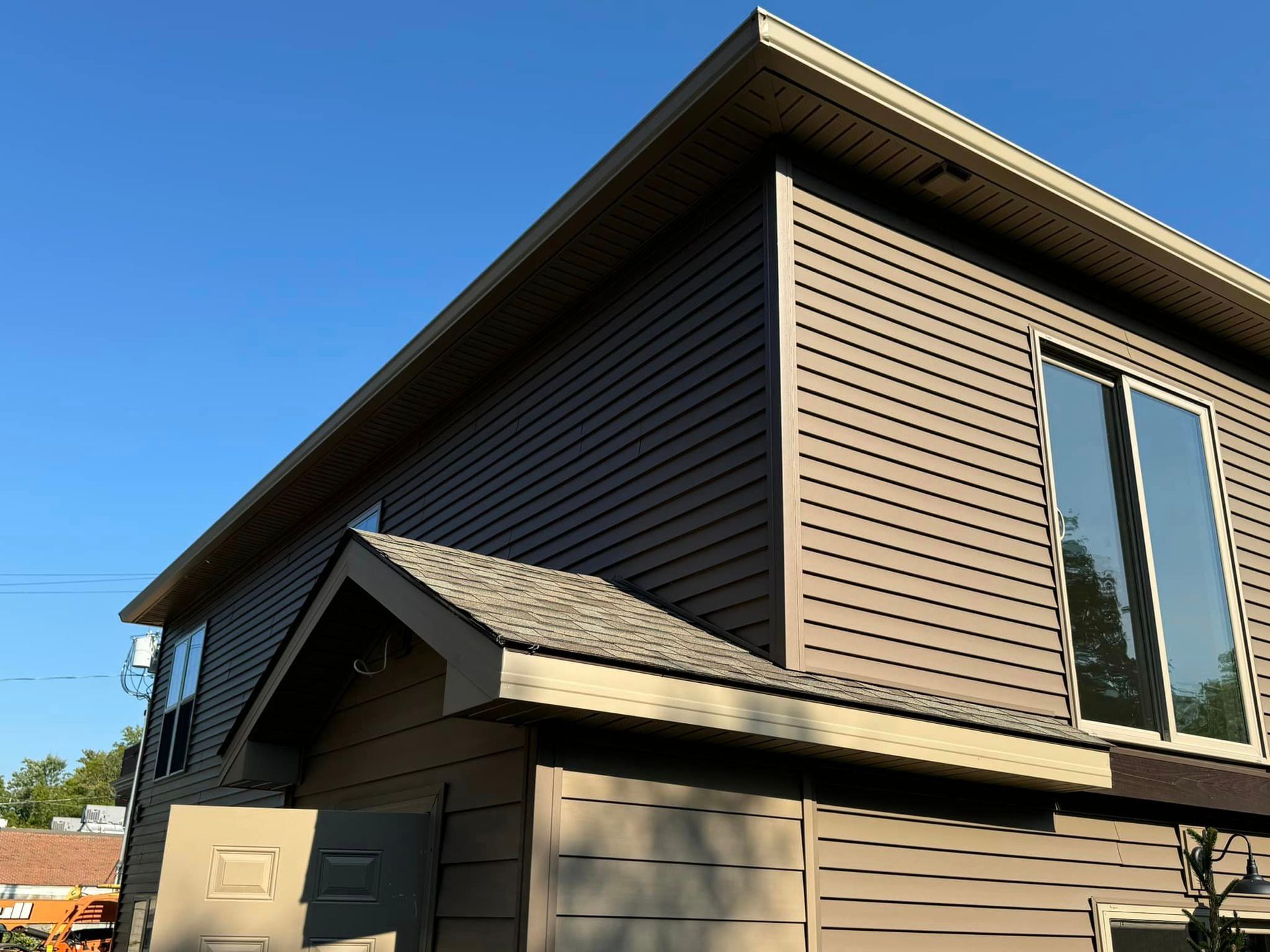 A building with siding and new gutters