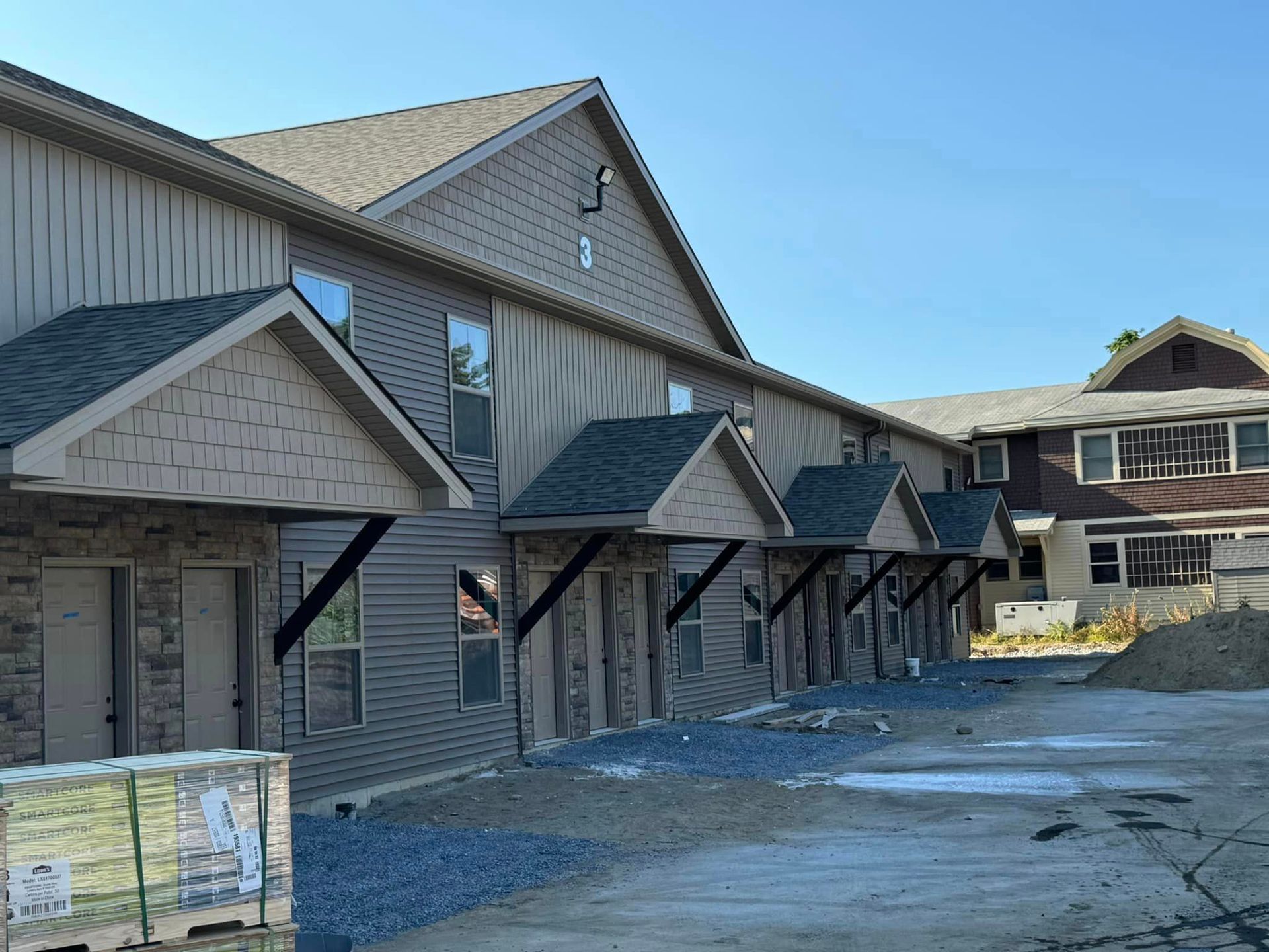 Front of a building with number 3 near the roof