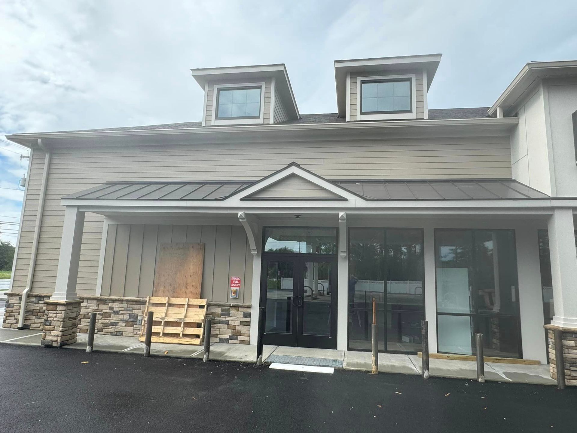 A building with a lot of windows and a porch