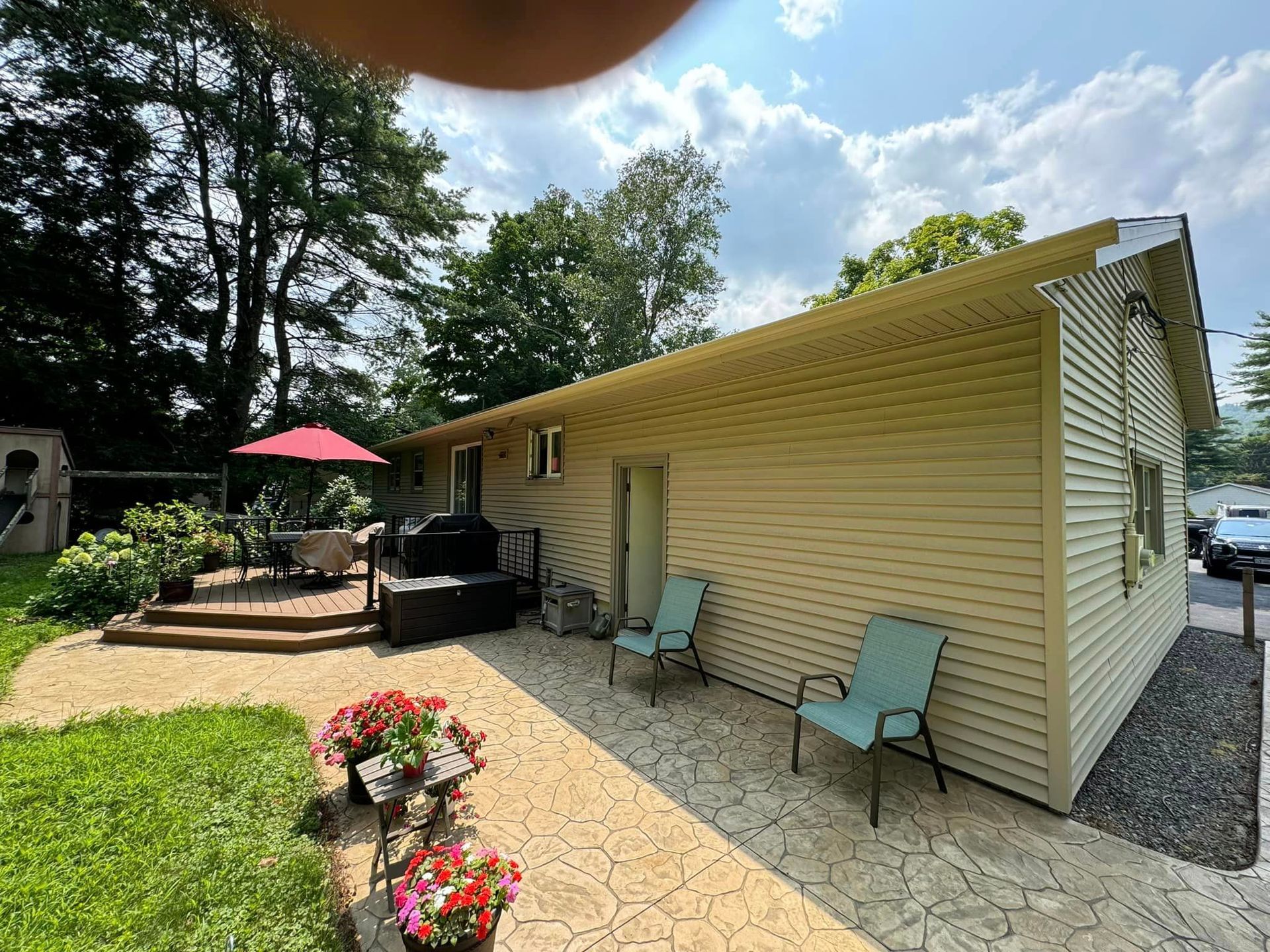 A house with a patio and chairs in front of it