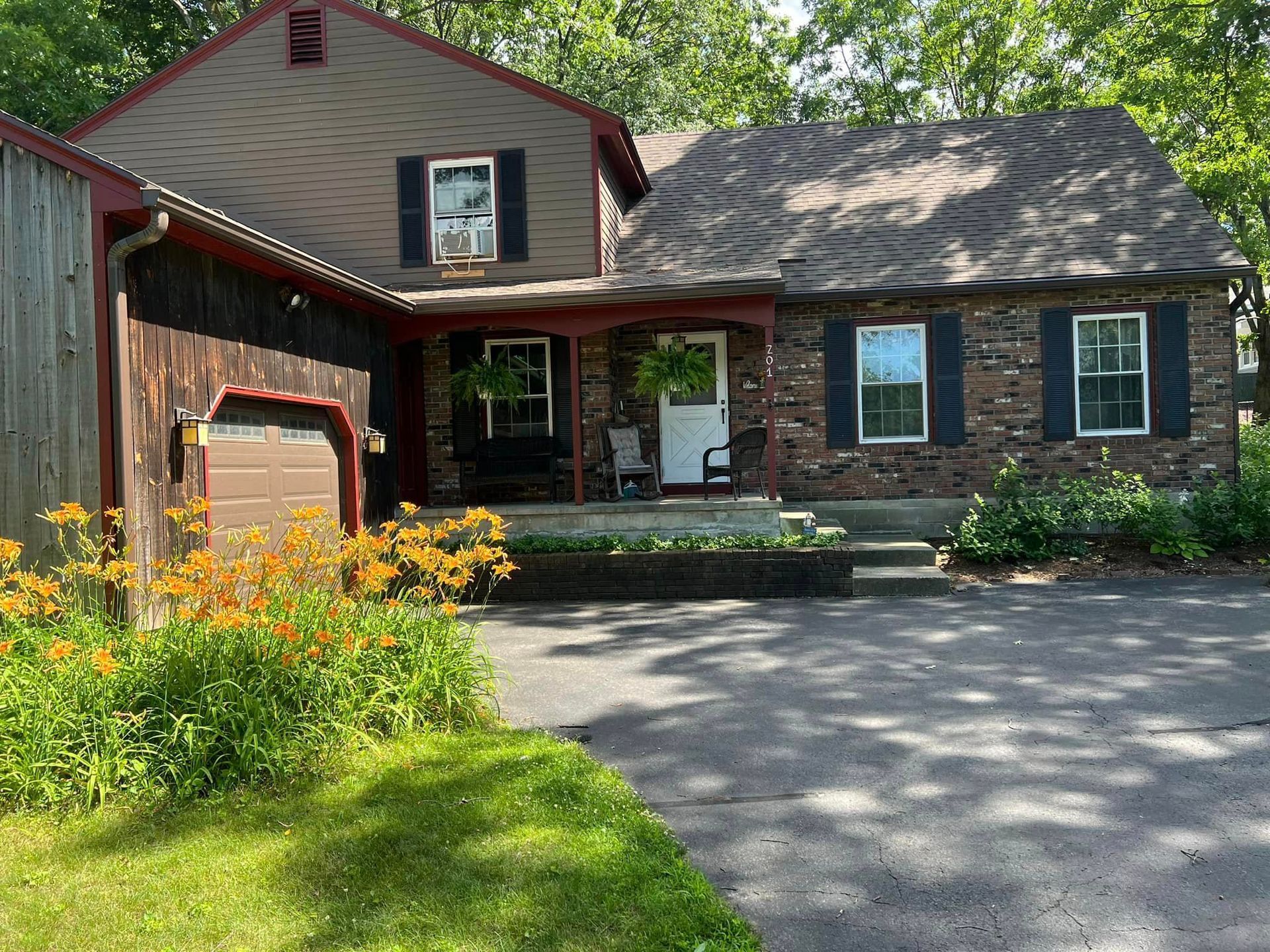 A house with a garage and a driveway in front of it