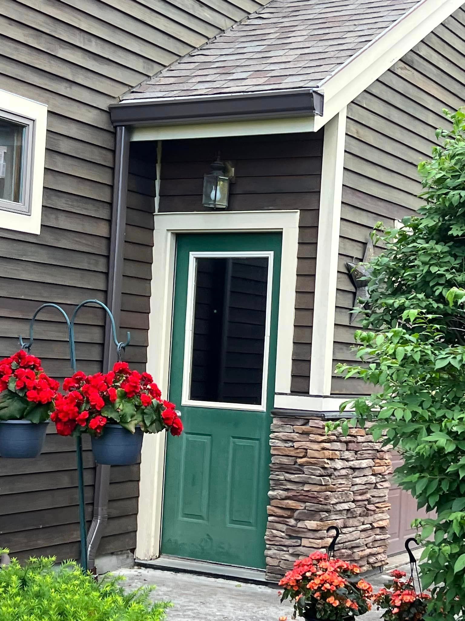 The front door of a house with a green door