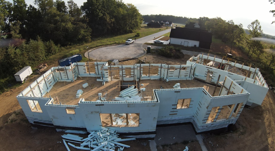 An aerial view of a large building under construction.