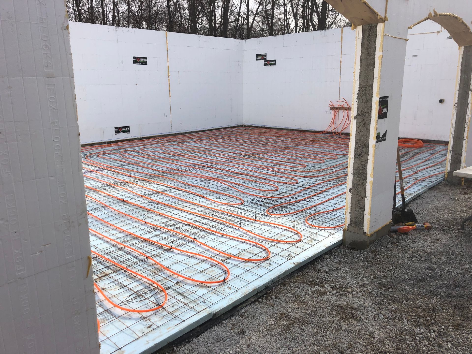 A room with a lot of pipes on the floor.