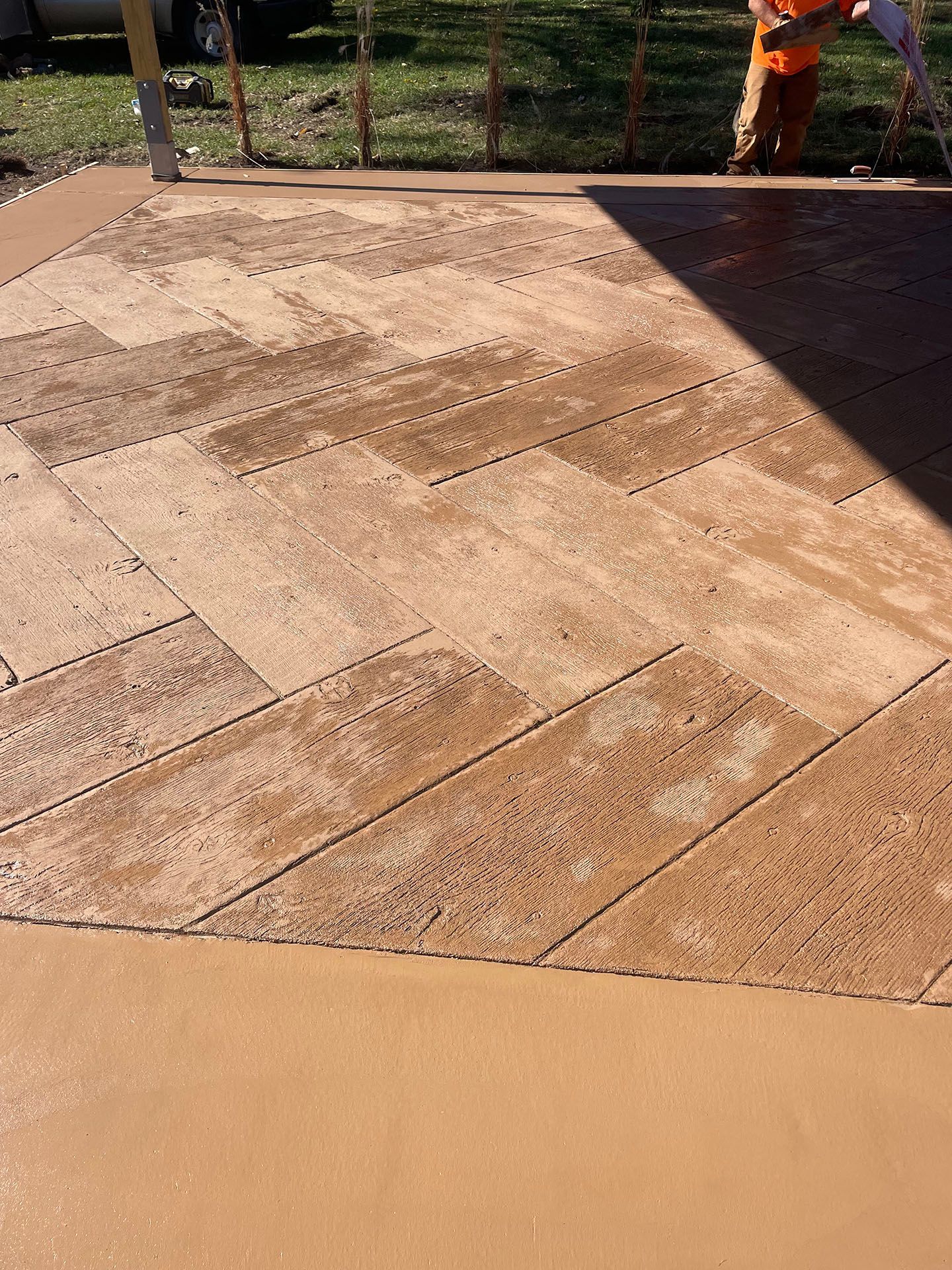 A man is standing on a concrete floor.