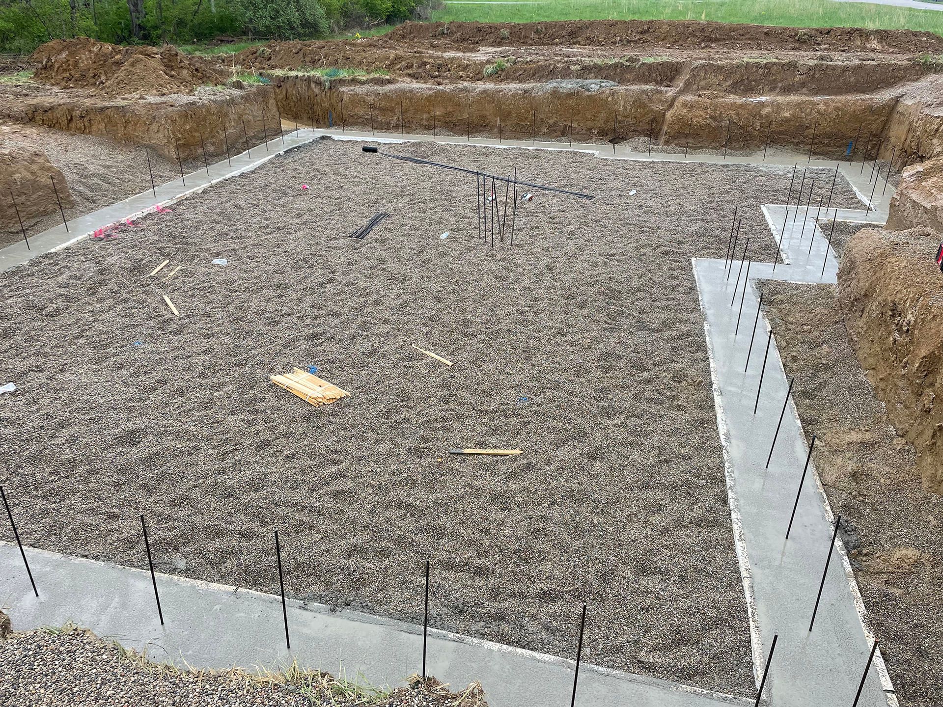 A construction site with a lot of dirt and concrete.