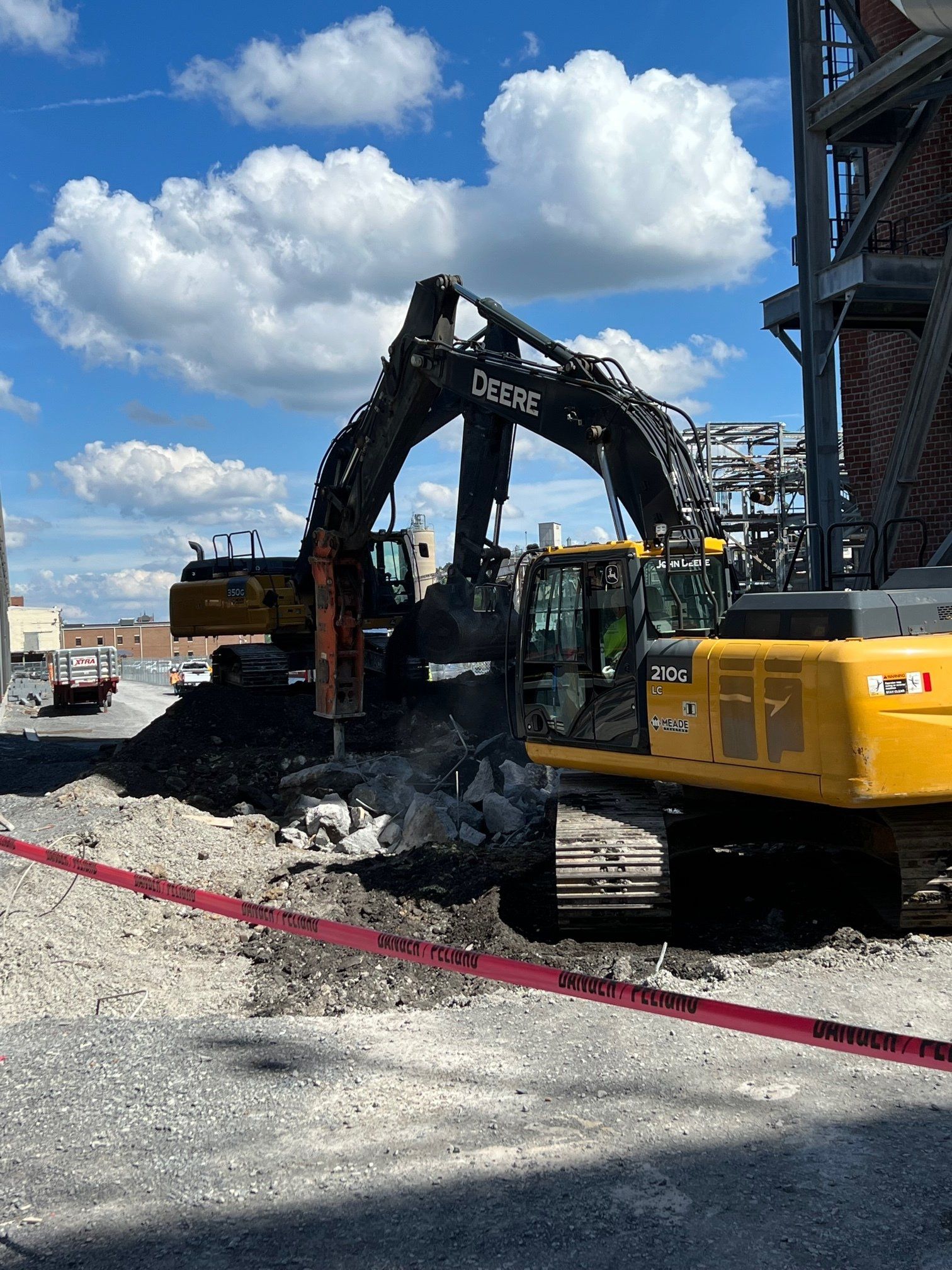 Hydraulic jackhammer and excavator working together