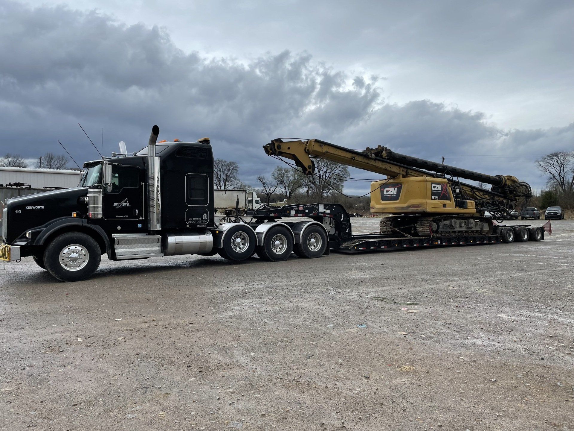 Big rig truck hauling a crane