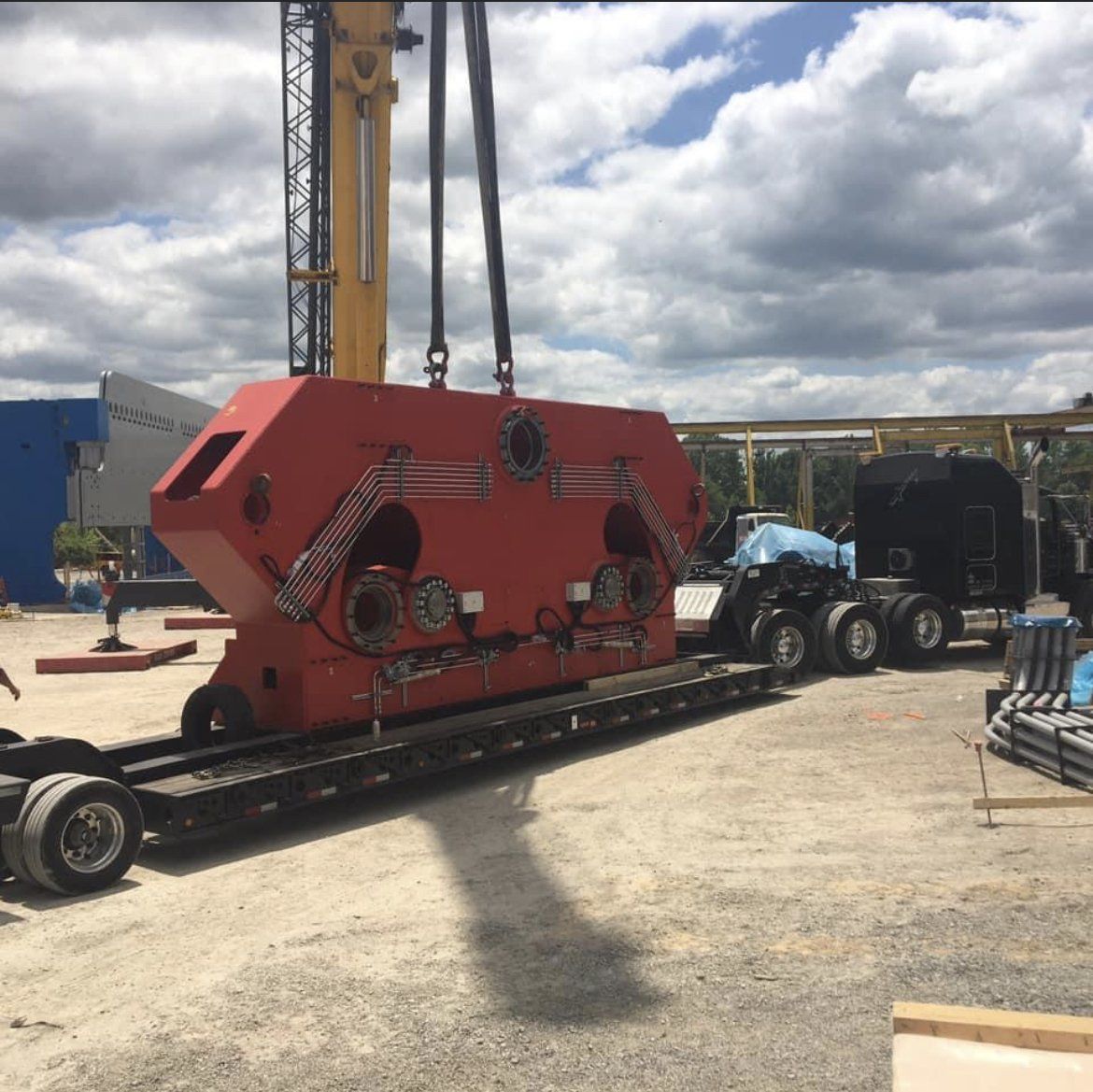 Big rig truck hauling a heavy industrial equipment
