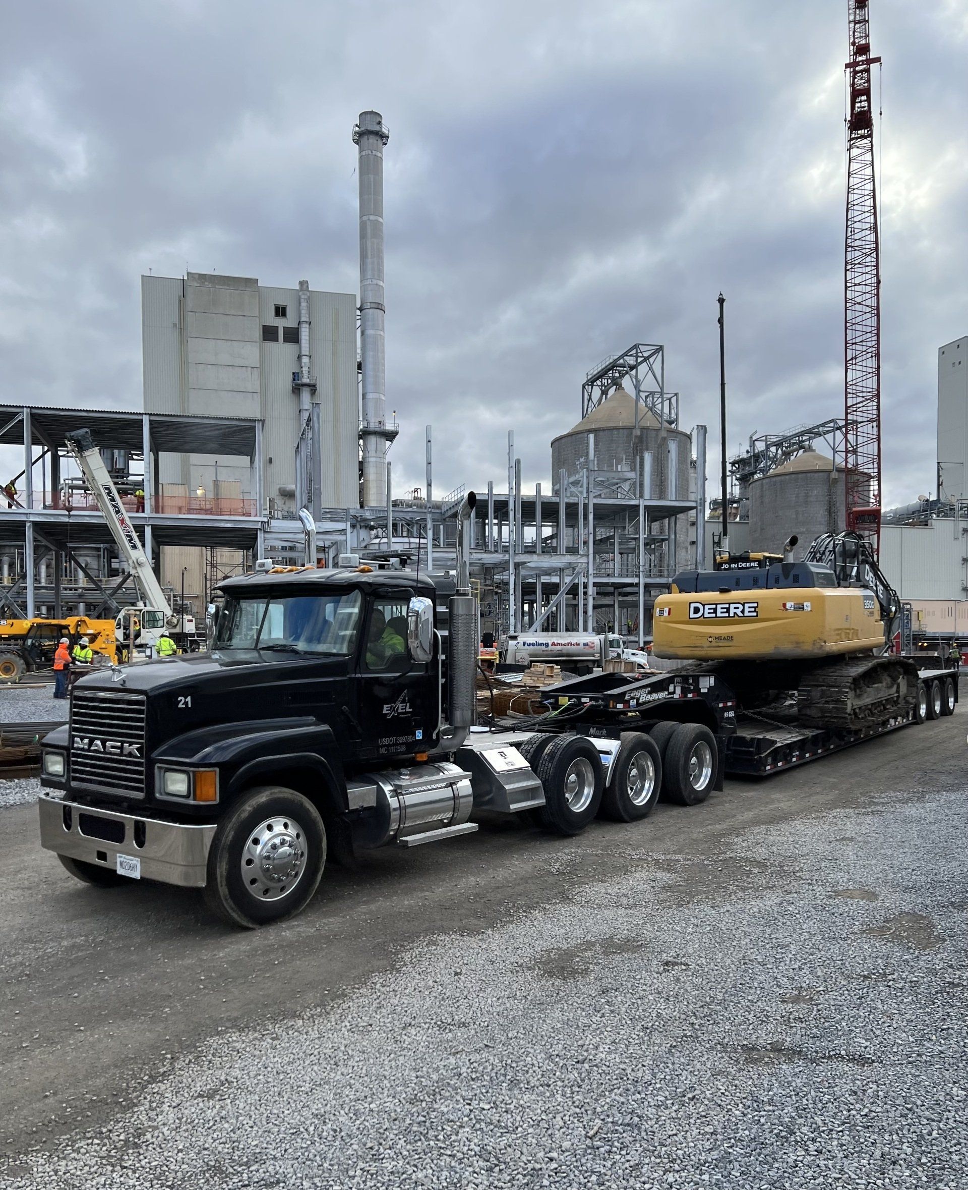 Big rig truck hauling a crane