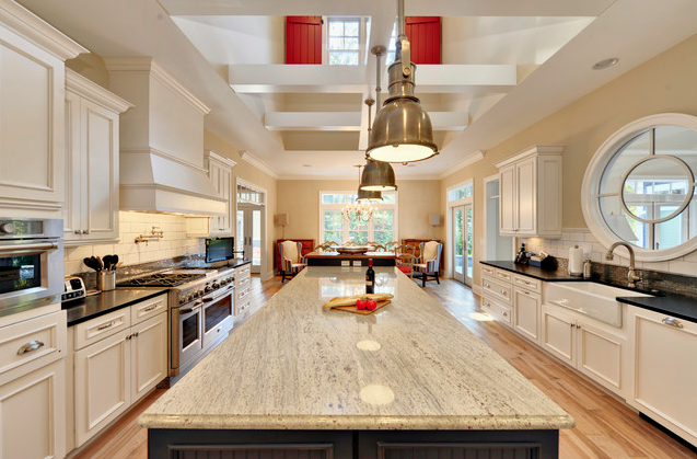 A large kitchen with a large island in the middle