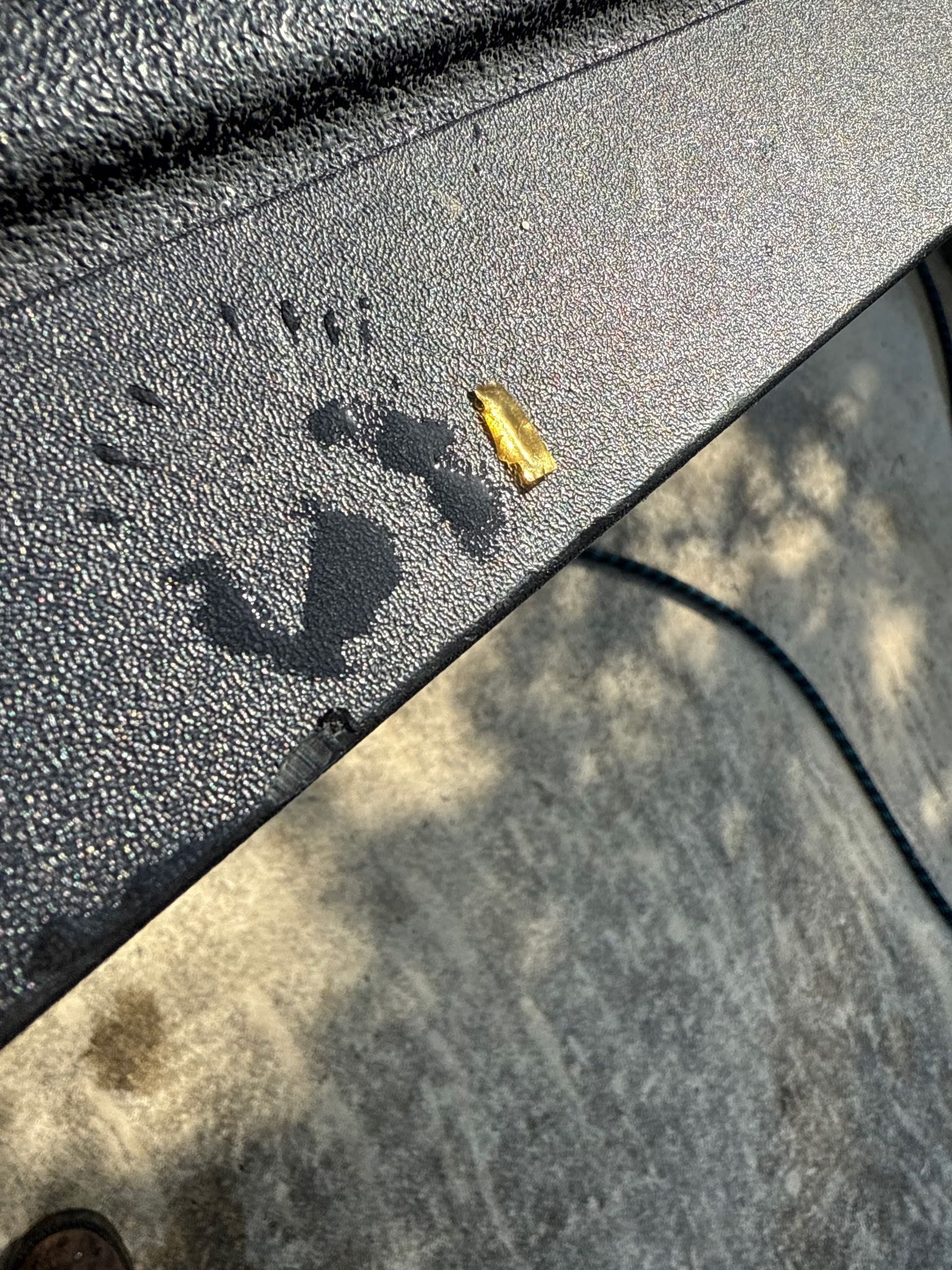 A close up of a table with a leaf on it.