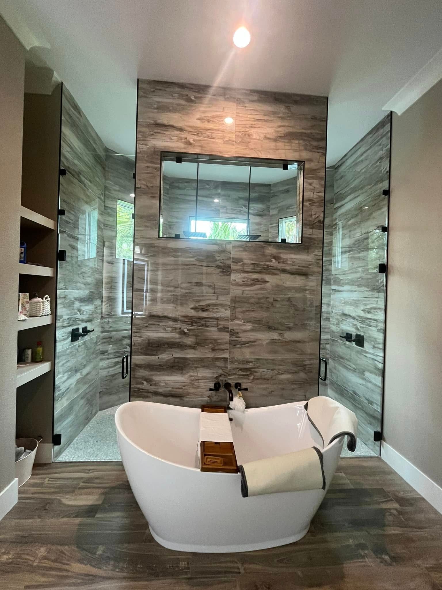A hallway features a large sliding wardrobe with frosted geometric panels and a central mirror next to wooden double doors.