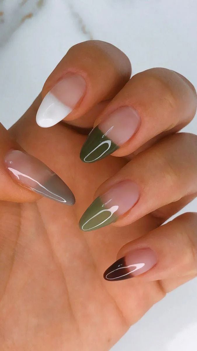 Hand with almond-shaped nails; French tips in white, brown, olive and a gradient brown.
