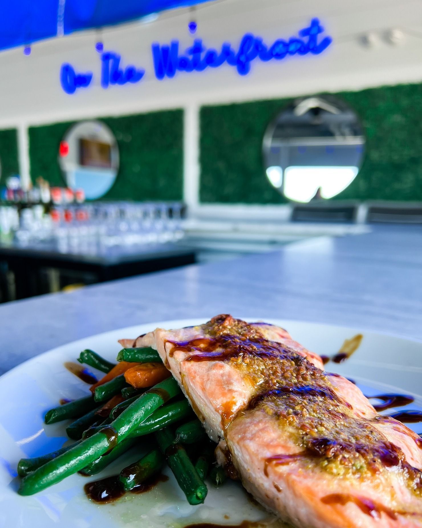 Salmon dish with green beans and carrots.