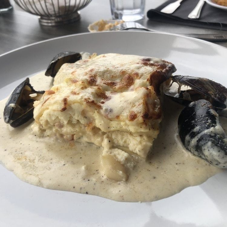 A seafood dish on a white plate.