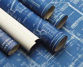 Rolled blueprints and construction plans