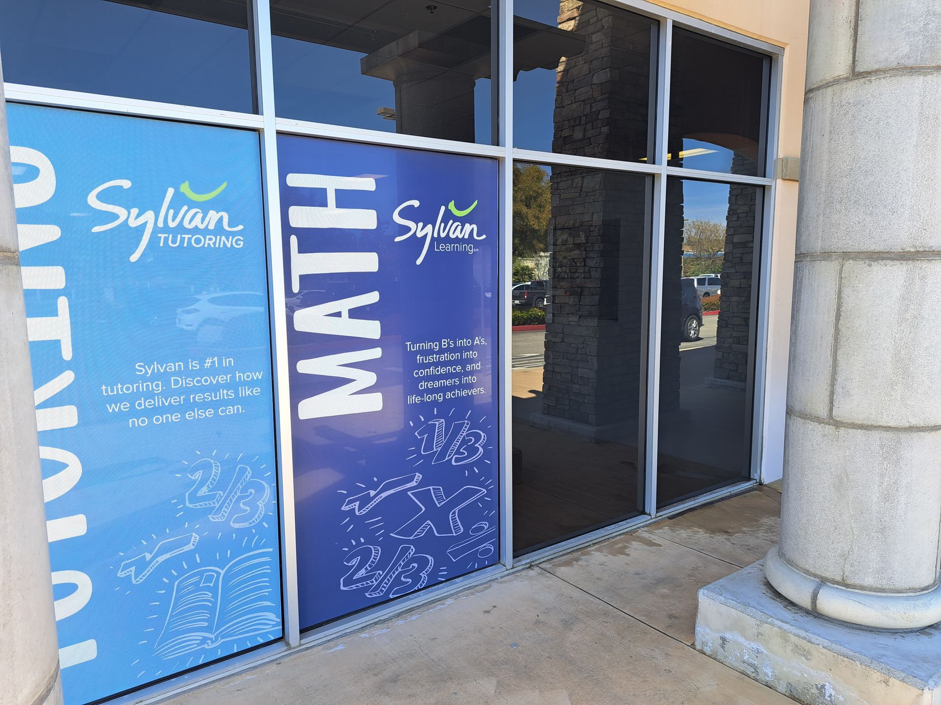 Sylvan Learning Center storefront with blue doors and large “MATH” signage at the entrance
