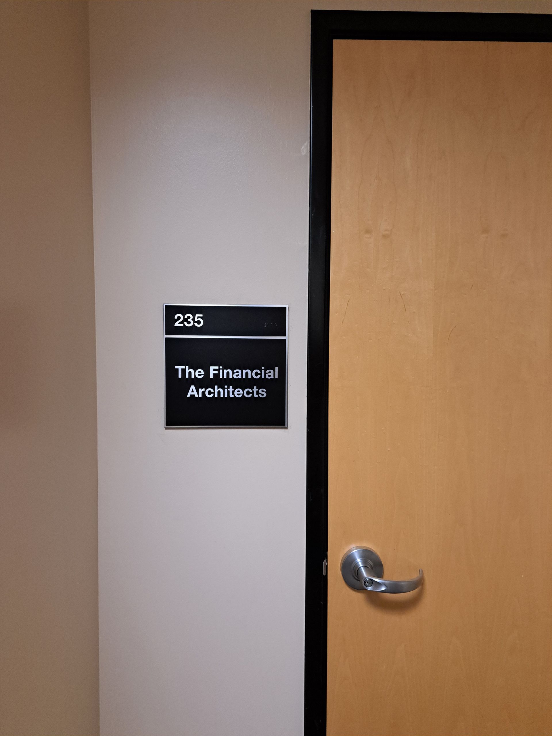 Office door with sign reading “236 The Farris Architects” and a silver handle