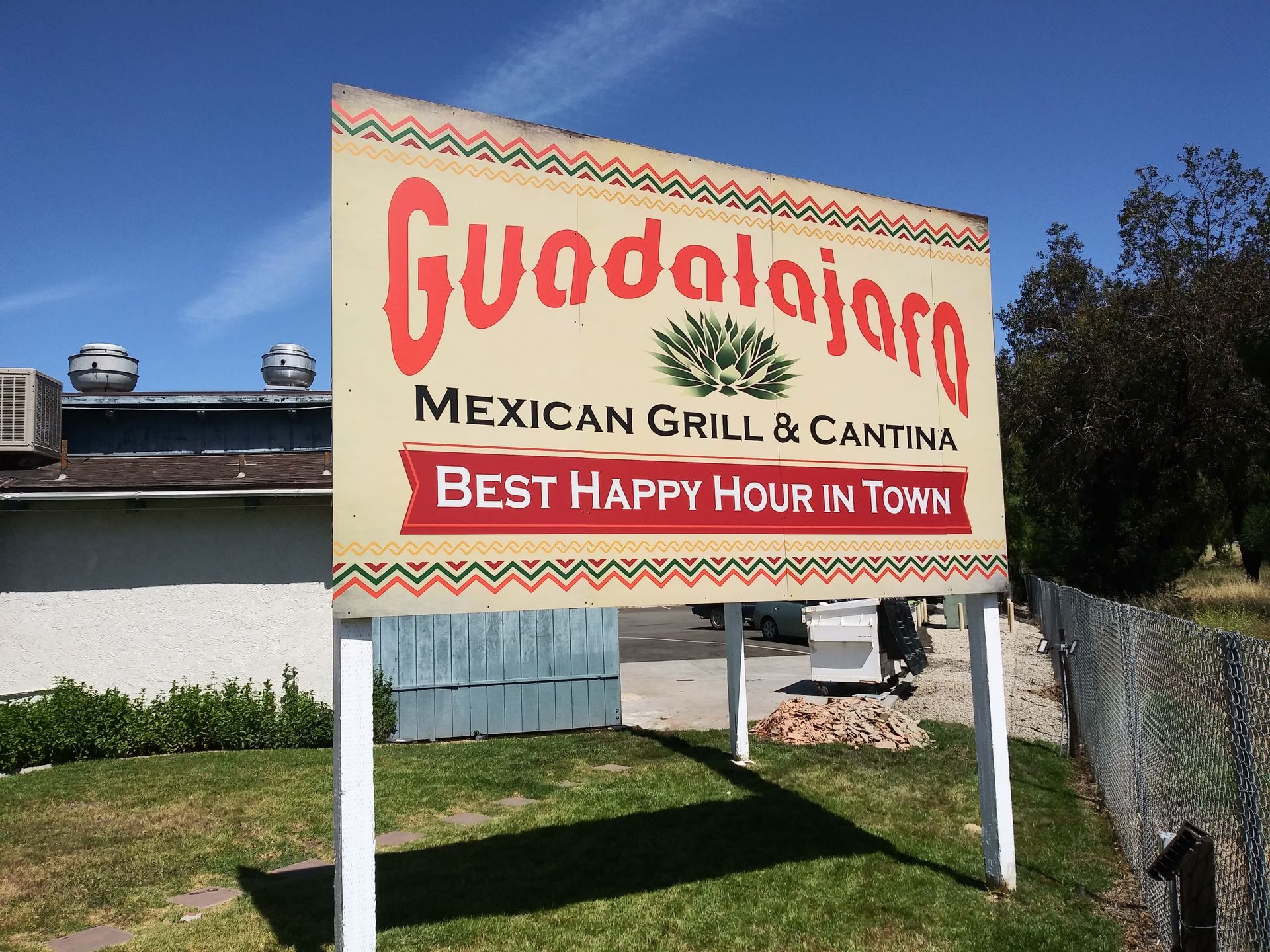 Guadalajara Mexican Grill and Cantina roadside sign with “Best Happy Hour in Town” in red and beige